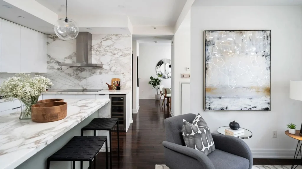Marble-accented kitchen with modern furnishings in a high-end Liberty Village Toronto apartment.